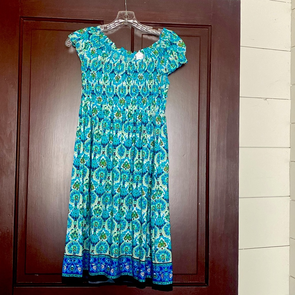 A bright blue green dress from 2000’s London Times